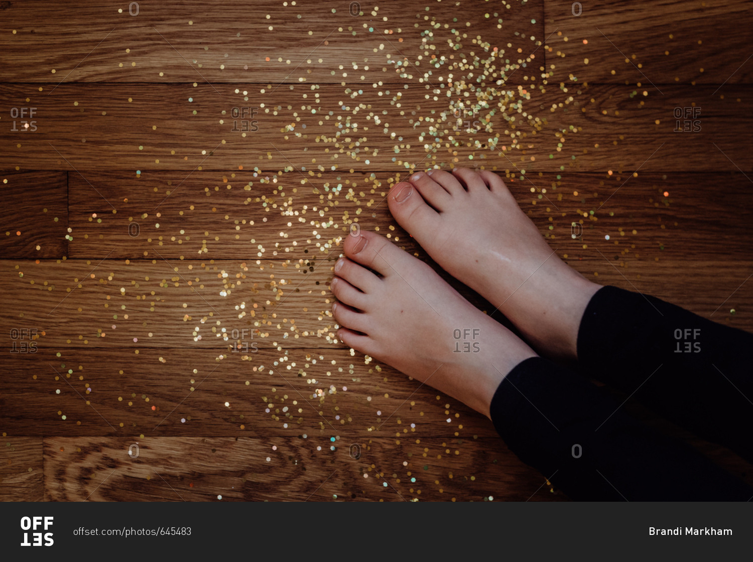 Little feet in spilled glitter