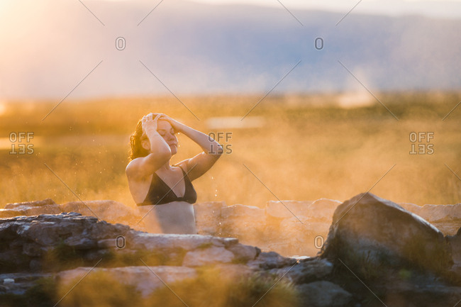 Woman Wearing Bikini Relaxing In Hot Spring