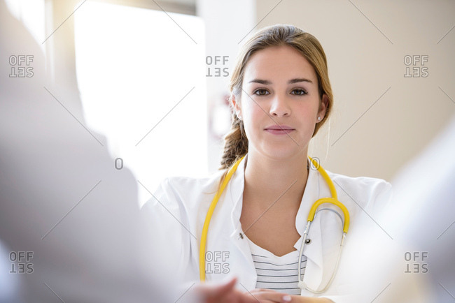 Portrait of female doctor in meeting, differential focus