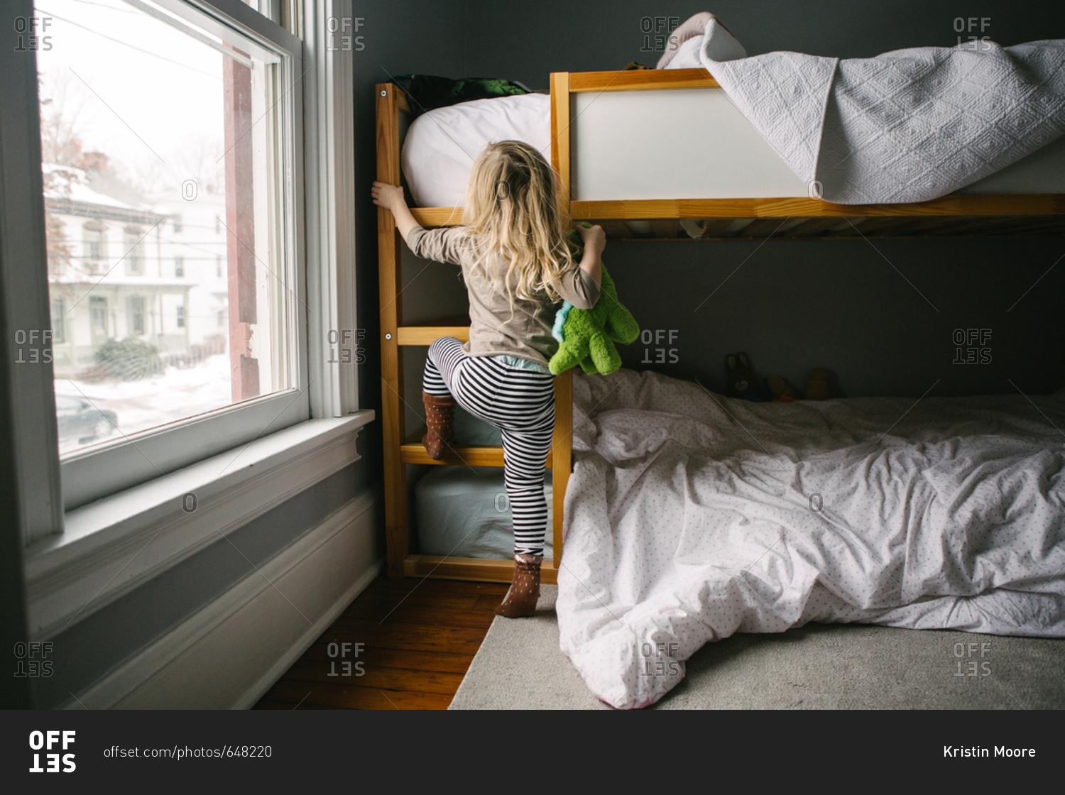 Woman In Ranch Style House Climbing Ladder To Bunk Bed Canvas