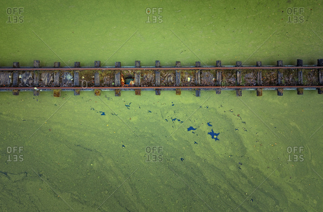 Abandoned rails over a lake