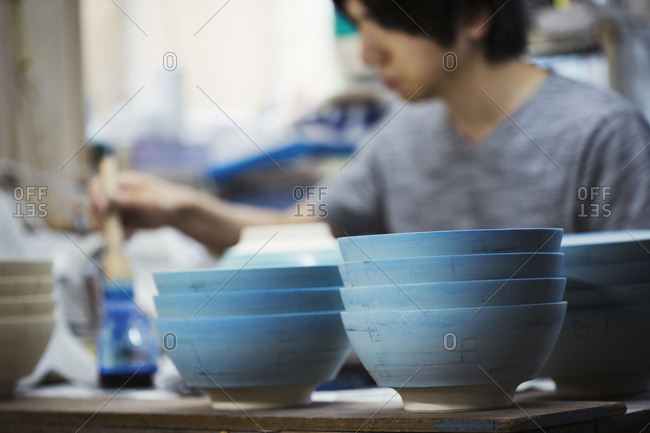 Hands molding clay in a pottery and ceramic studio in Chiang Mai, Thailand  stock photo - OFFSET