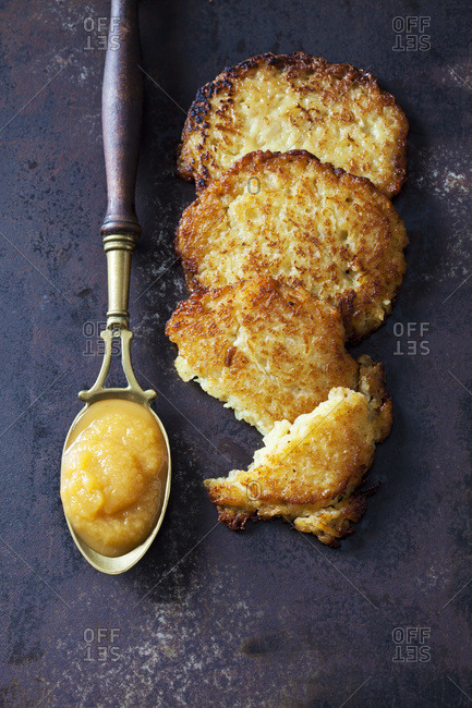 Potato fritters and spoon of apple sauce