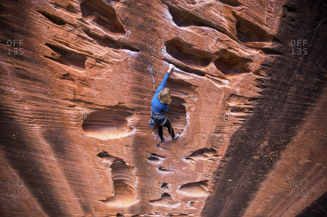 High angle view of woman rock climbing at Zion National Park