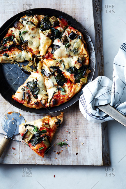 Skillet pizza with eggplant and greens