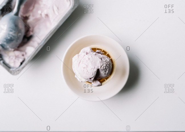 Ice cream cones in glass containers stock photo - OFFSET