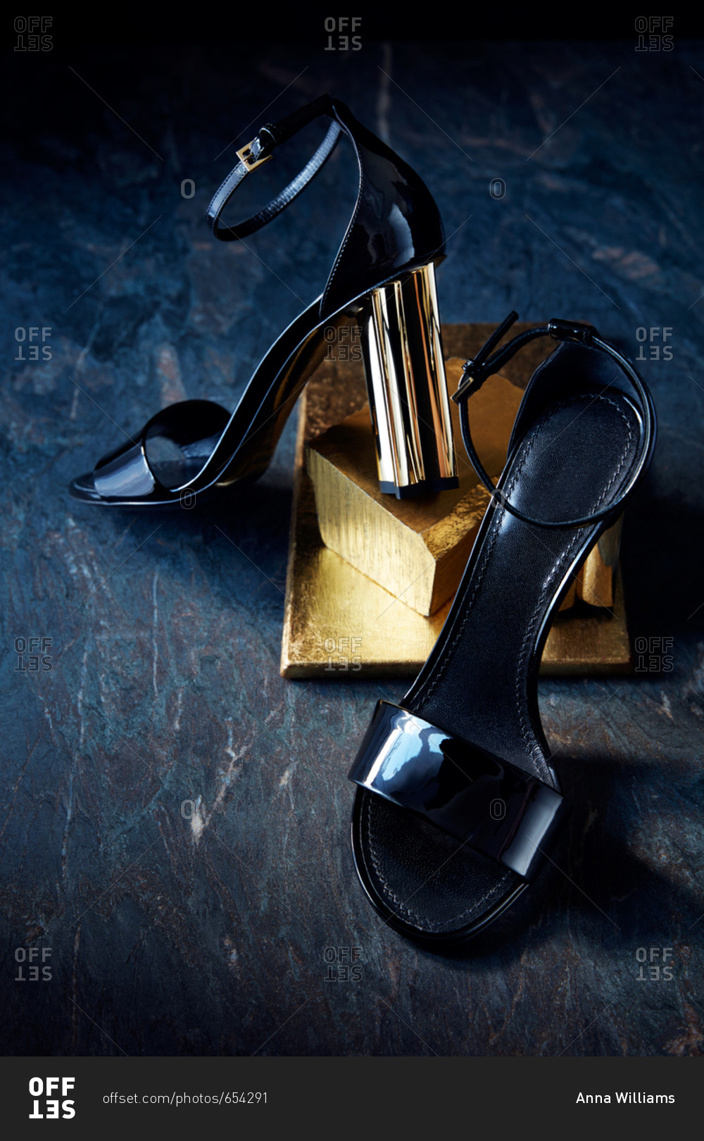Strappy high heel sandals with a gold heel