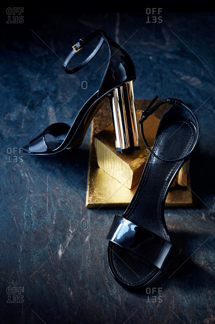 Strappy high heel sandals with a gold heel