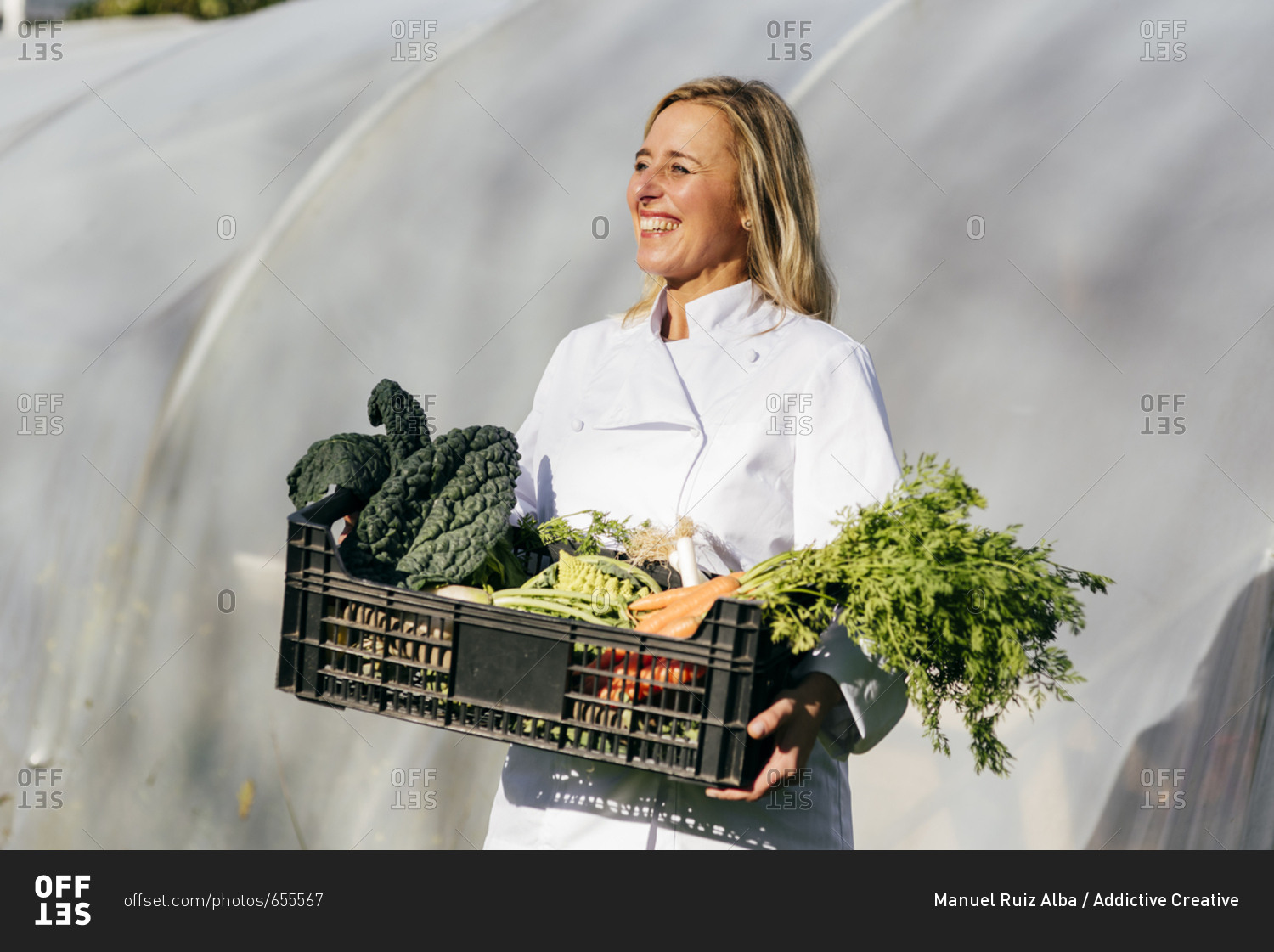 Woman with vegetables in box