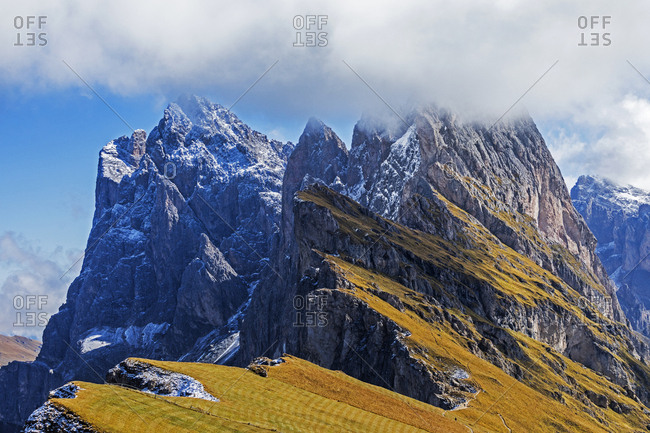Clouds obscuring Seceda formation in Val Gardena area of Dolomite Mountains, Italy
