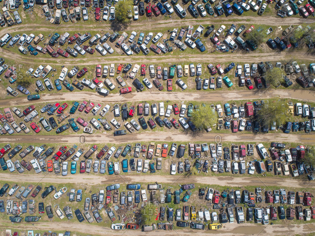 Aerial view of wrecked cars parked in a land fill scrapyard. stock ...