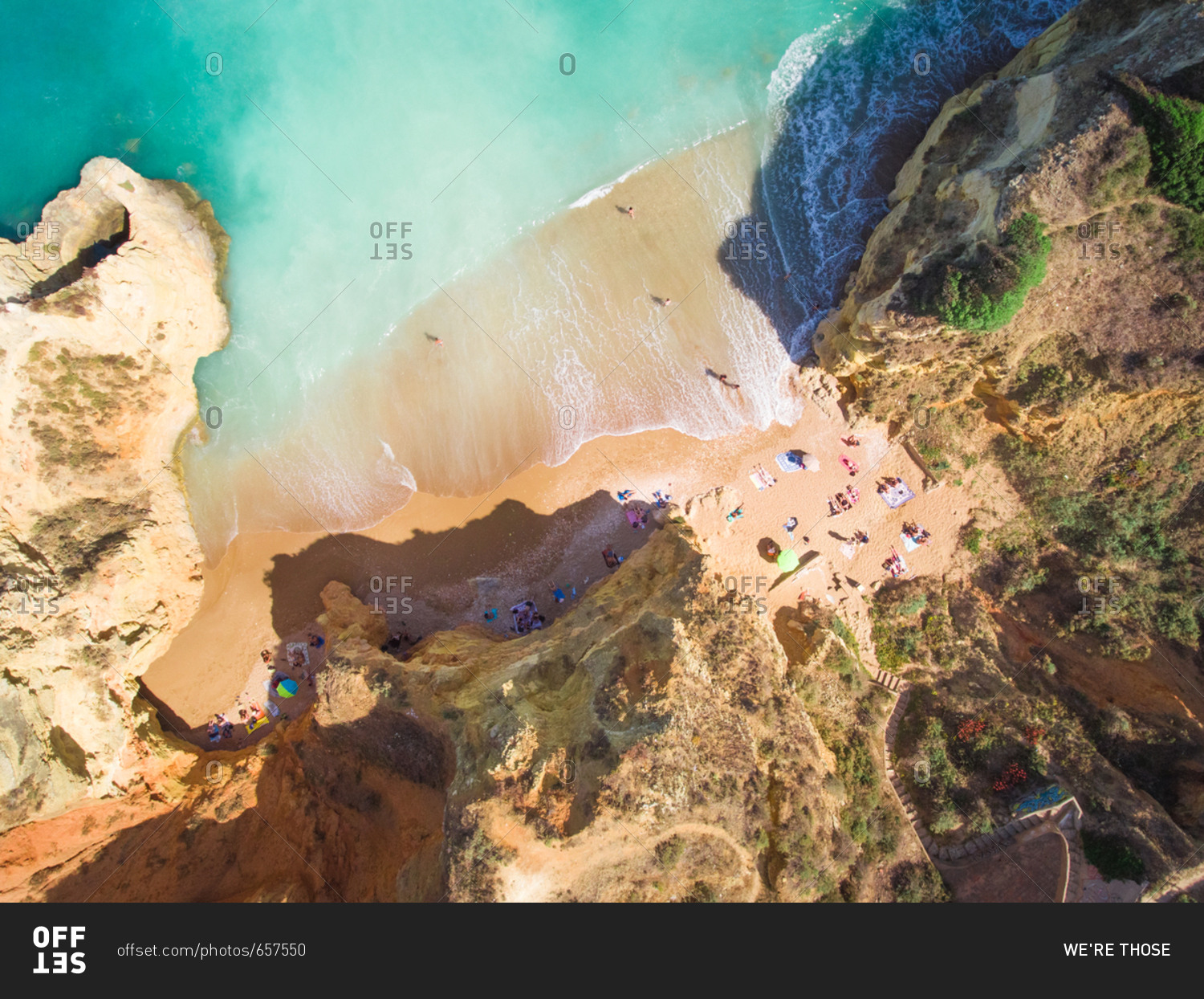 Aerial photography of Pinh�o Beach surrounded by cliffs in Lagos, Portugal.