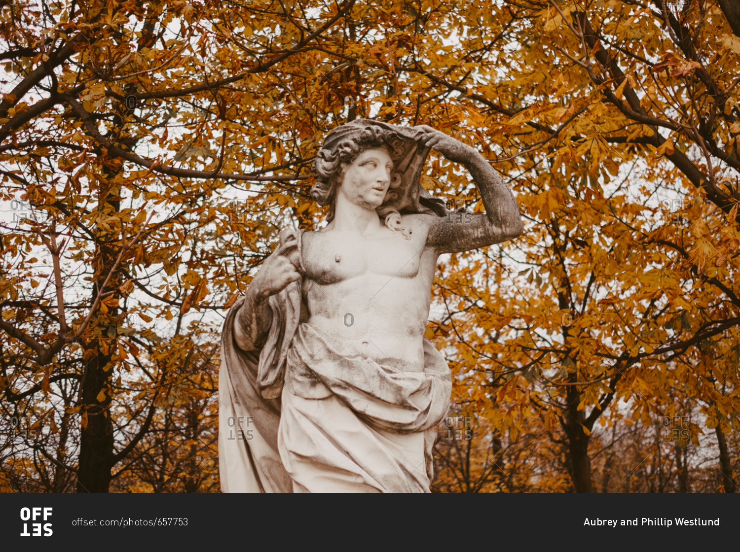Sculpture in Tuileries garden with fall leaves in background