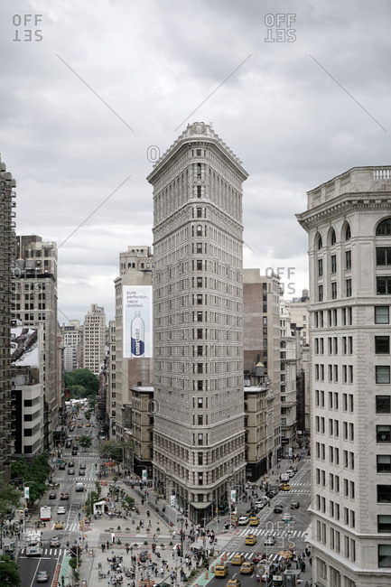 New York, United States of America - May 27, 2017: The view of the Flatiron Building also known as the Fuller Building. It is a triangular 22-story building in Manhattan and has been named as one of the world's most iconic skyscrapers and a quintessential symbol of New York City.