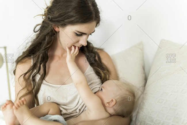 Mother Breastfeeding Newborn Baby Girl. Top View. Stock Image