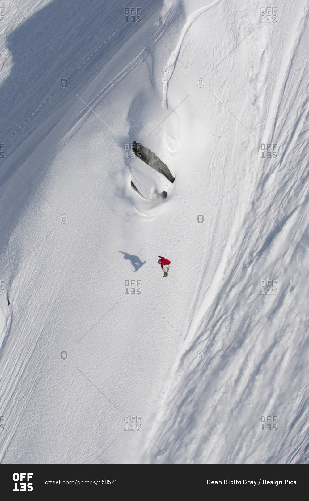 Extreme Snowboarding On A Snow Covered Slope; Haines, Alaska, United States Of America