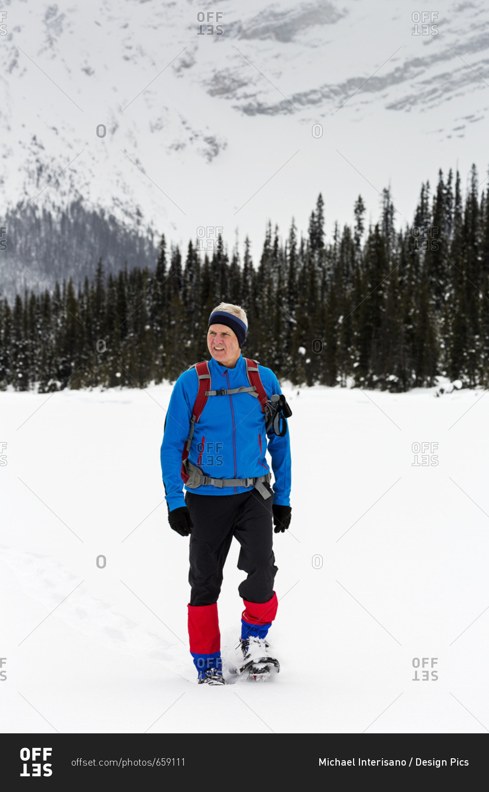 Man Snowshoeing In The Mountains, East Of Field; British Columbia, Canada