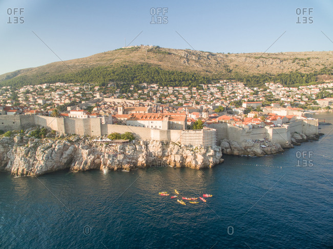 Aerial view of old city of Dubrovnik (Croatia), popular tourist attraction on Adriatic. Srdj mountain in the background.