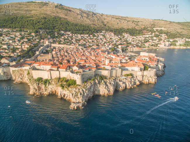 Aerial view of old city of Dubrovnik (Croatia), popular tourist attraction on Adriatic. Srdj mountain in the background.