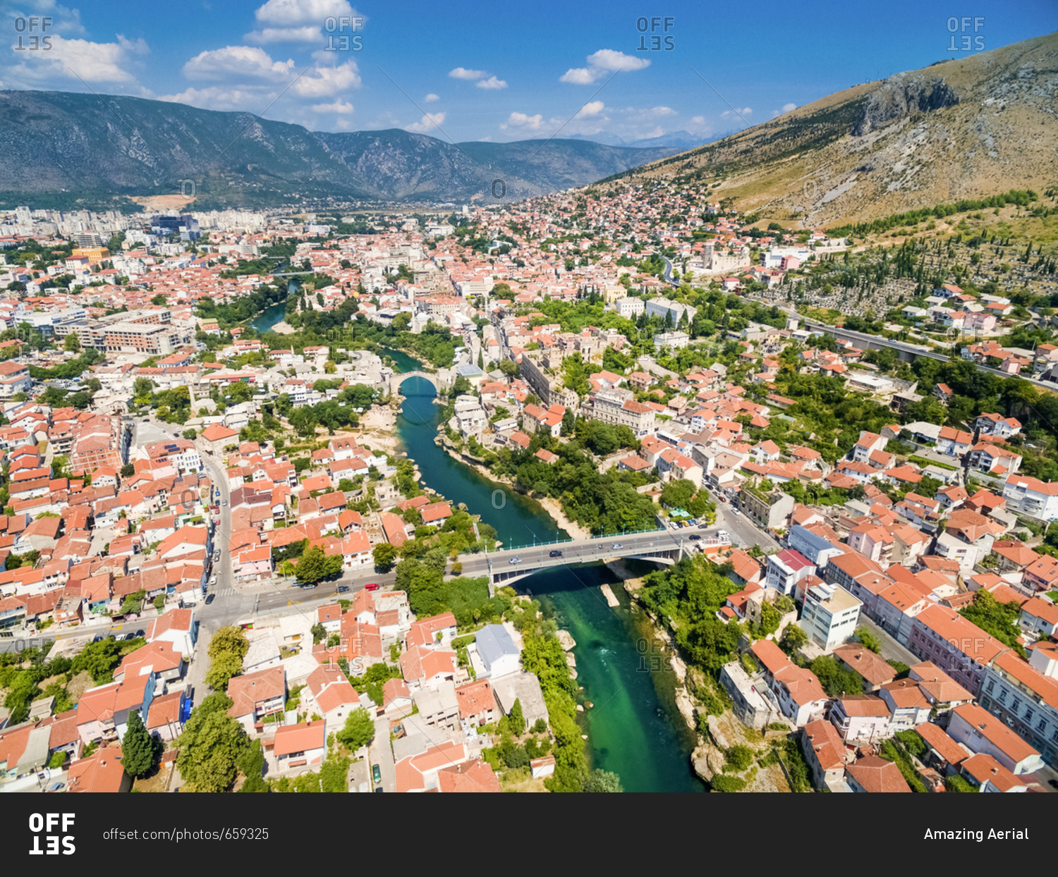 Aerial view of city of Mostar in Bosnia and Herzegovina and it\'s landmarks (Neretva river, Old bridge, Koski Mehmed Pasha Mosque).