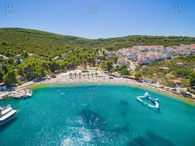 Aerial view of housing estate and beach at Necujam bay at Solta, Croatia.