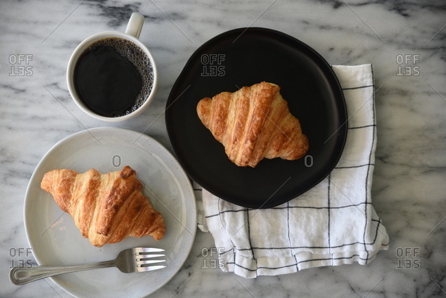 Overhead view of croissants and coffee