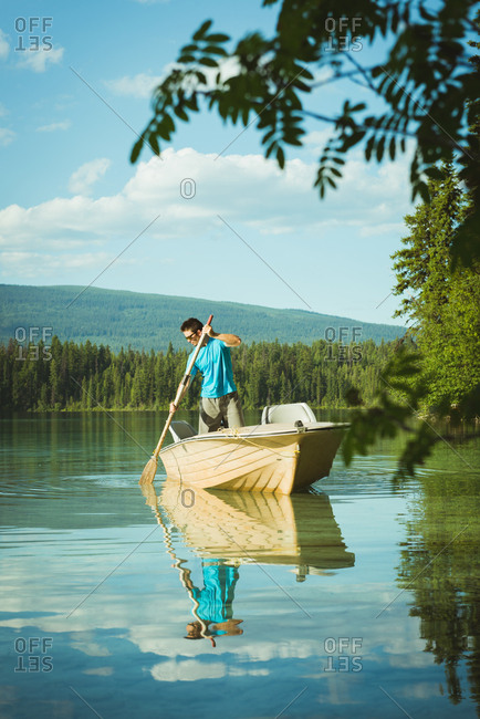 Man travelling in motorboat on a lake
