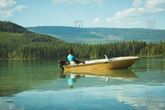 Man travelling in motorboat on a lake