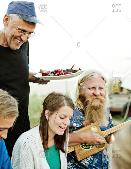 Family eating together in Friseboda, Sweden