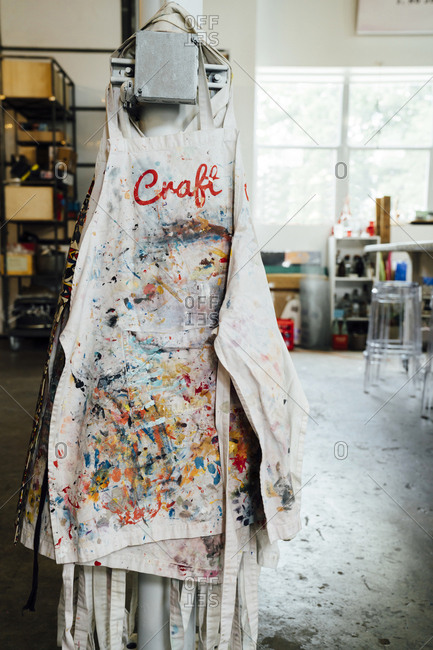 Messy aprons hanging in office