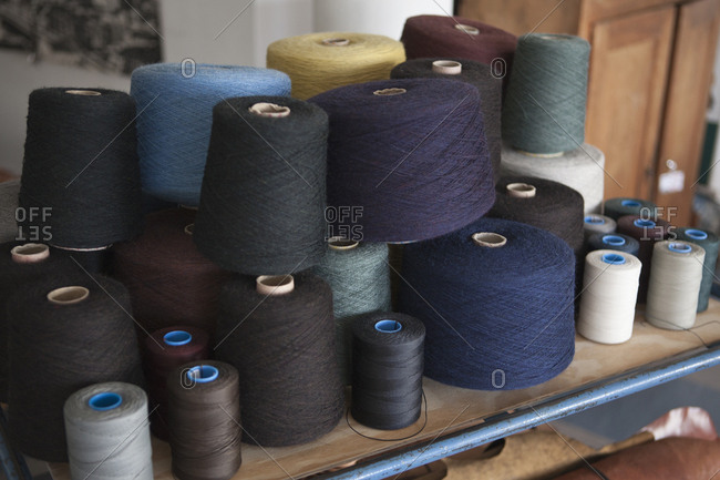 Spools of cotton on a workbench