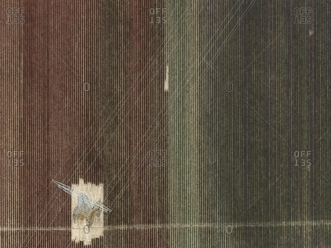 Aerial view of electricity pylon in agricultural field, Stuttgart, Baden-Wuerttemberg, Germany