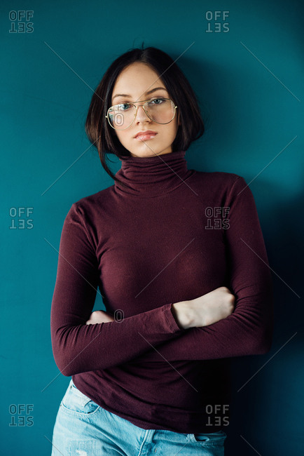 Portrait of teenager girl with retro glasses wearing turtle neck shirt