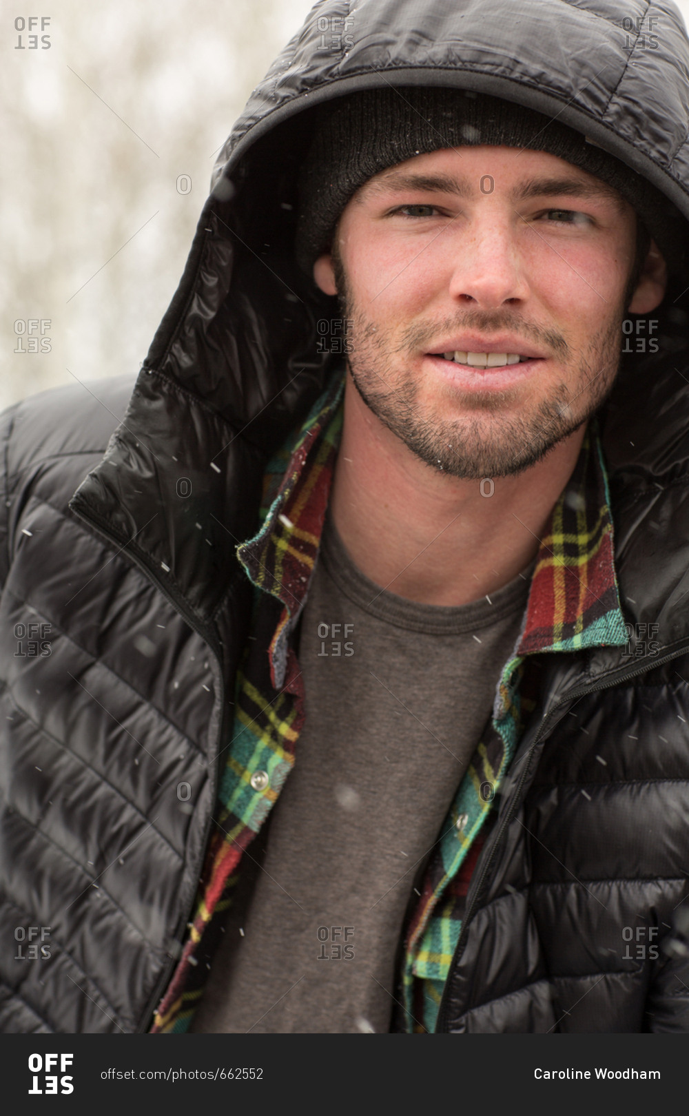 portrait-of-a-man-outdoors-wearing-black-jacket-in-winter-stock-photo