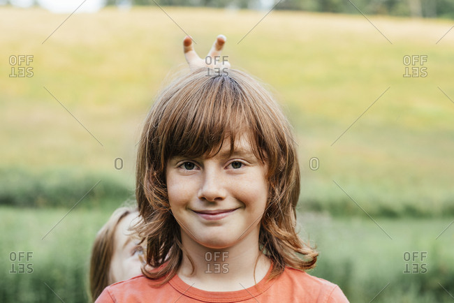 Portrait of smiling boy with sister