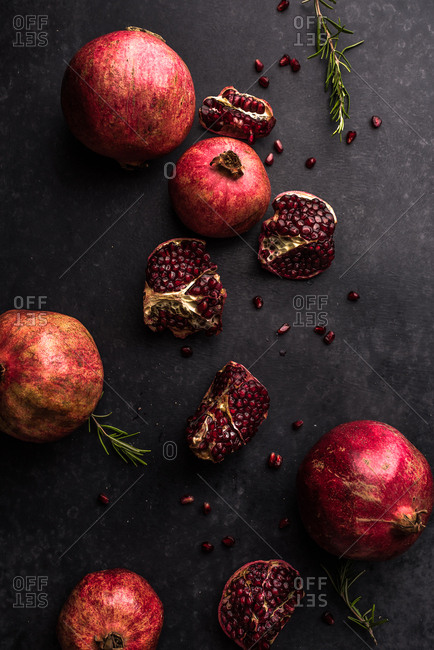 Still life with pomegranates and rosemary