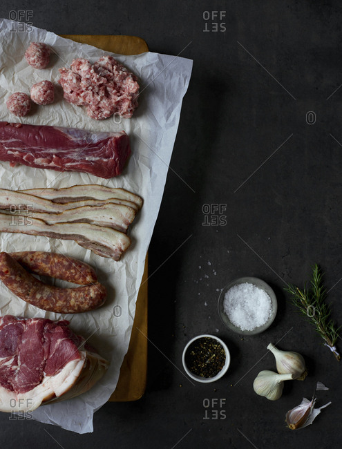 Cuts of raw meat on a cutting board