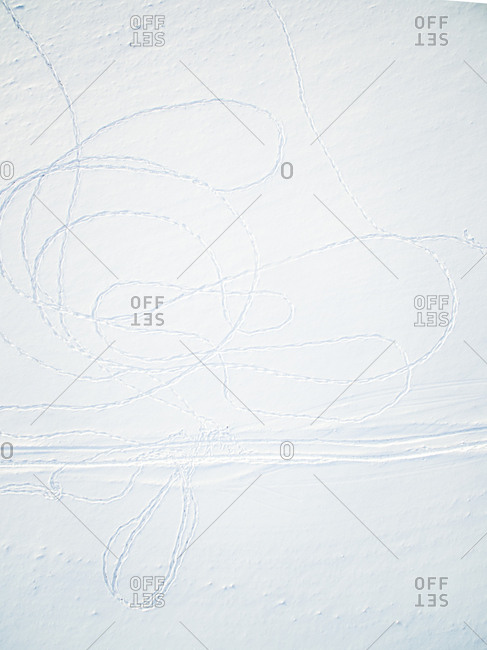 Abstract aerial view of drawings made with footprint in snow