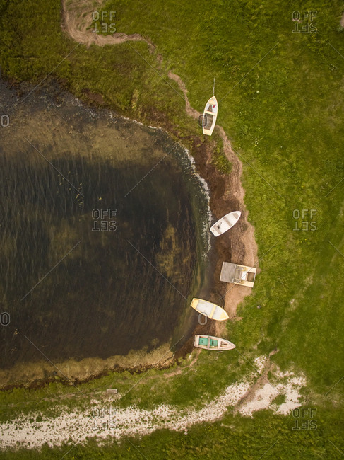 Aerial view of small wooden boat moored on a small beach on island Vormsi in Estonia