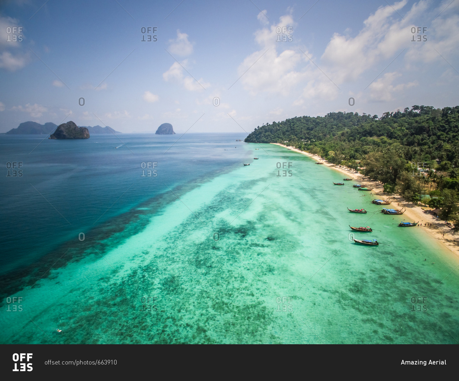 Aerial view of traditional long-tail boats moored in the bay of Chao Mai National Park in Thailand