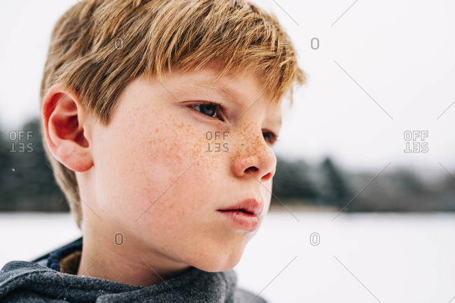 Close up of young boy in snowy environment