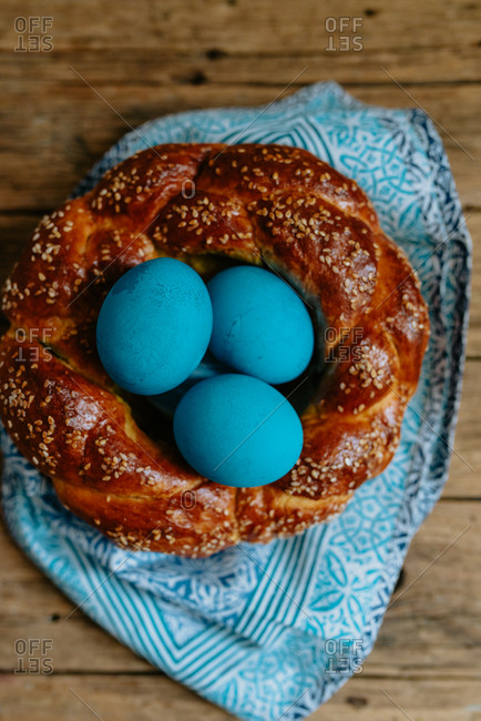 Blue Easter eggs in braided pastry made as a nest