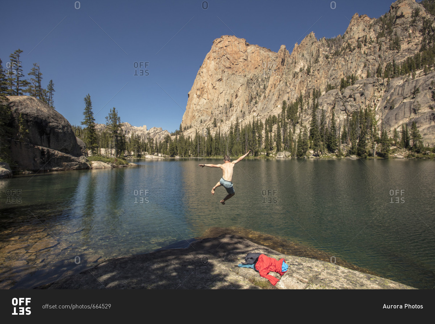 Man jumping into one of Saddleback Lakes, Sawtooth Mountains, Sawtooth National Recreation Area, Stanley, Idaho, USA