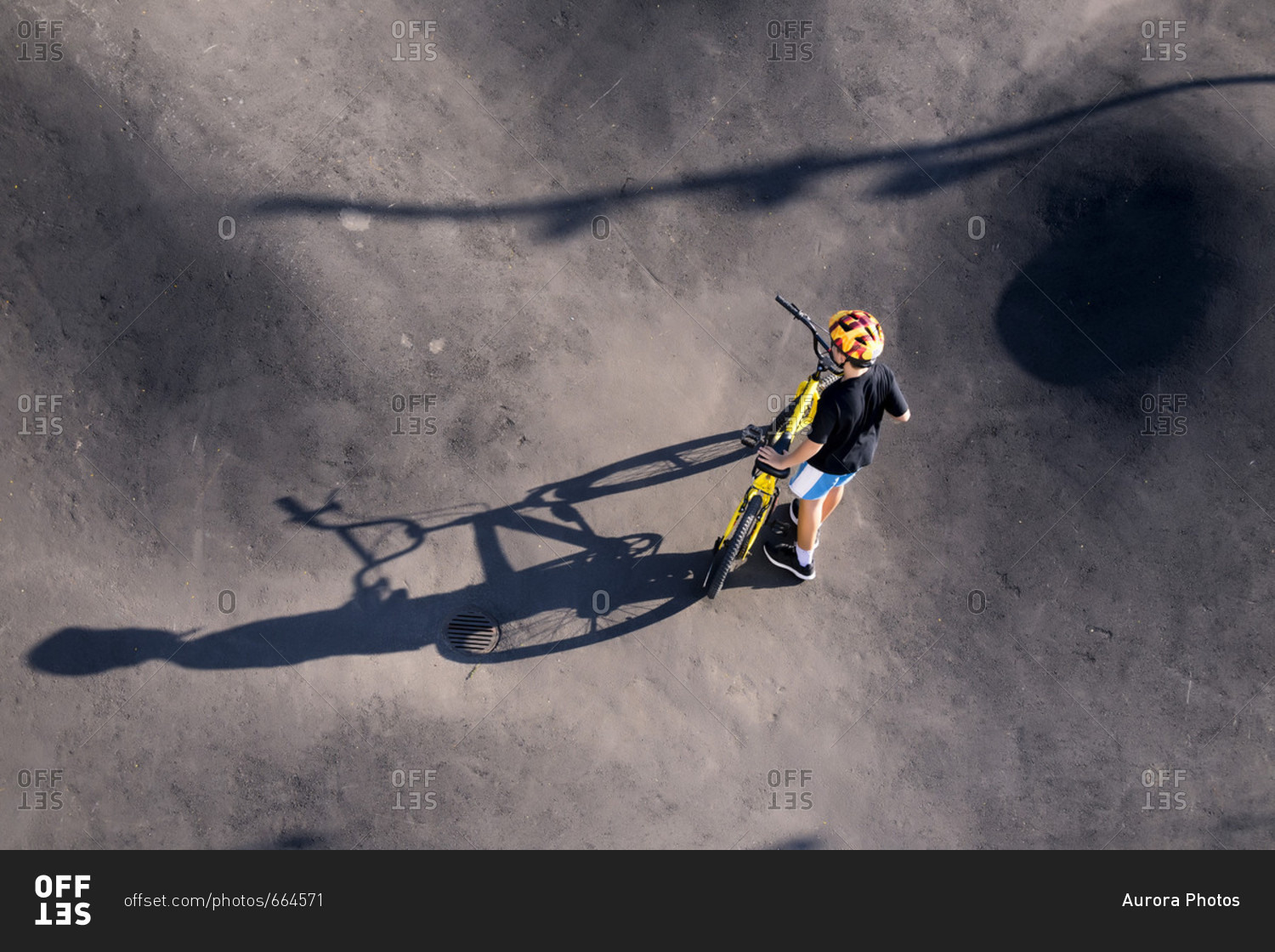 Boy with BMX bike in skate park, Canggu, Bali, Indonesia