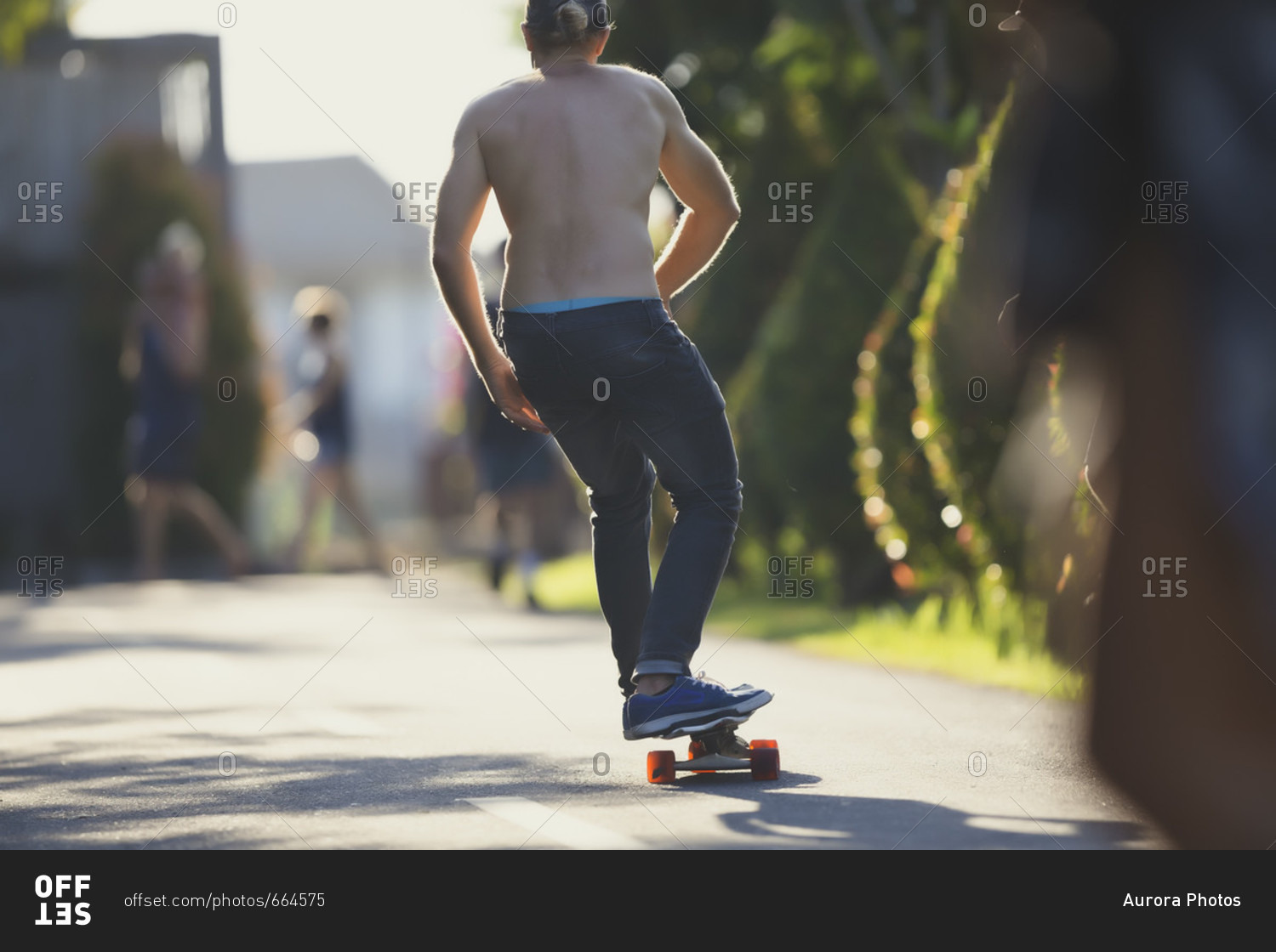 Young man skateboarding in street, Canggu, Bali, Indonesia