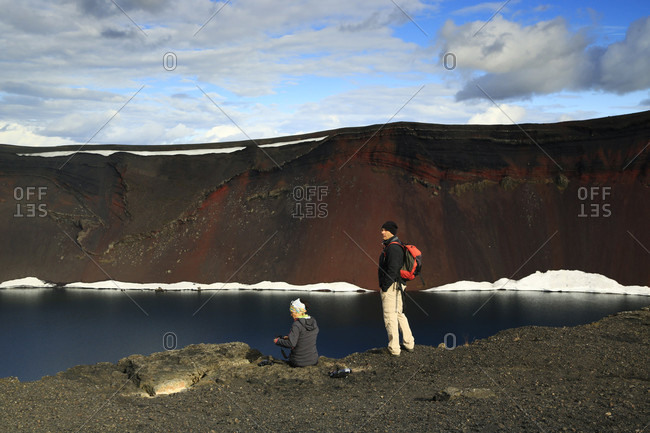 Ljotipollur volcanic crater, Landmannalaugar, Iceland - July 4, 2016: Two tourists visiting Ljotipollur volcanic crater, Iceland