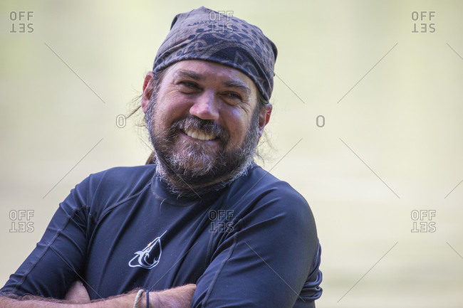 Manu National Park, Peru, Peru - May 6, 2017: Man smiles while on jungle river expedition in the Peruvian Amazon