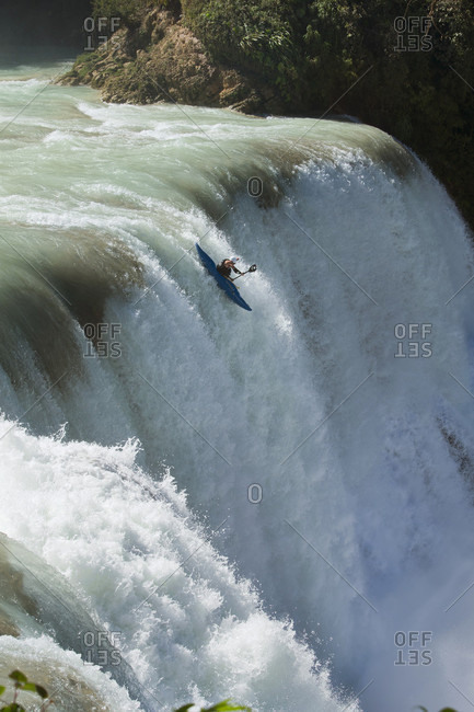 Agua Azul, Chiapas, Mexico - May 12, 2014: Kayaker running down waterfall of Agua Azul, Chiapas, Mexico
