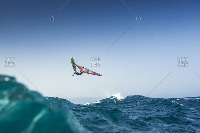 El Cabezo, Tenerife, Spain - July 29, 2016: Professional windsurfer in mid-air, El Cabezo, Tenerife, Canary Islands, Spain