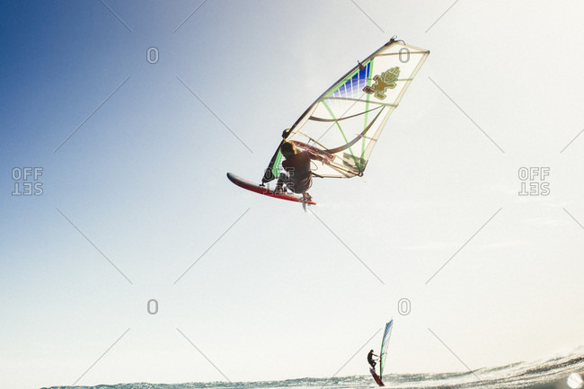 El Cabezo, Tenerife, Spain - February 16, 2018: Professional windsurfer in mid-air, El Cabezo, Tenerife, Canary Islands, Spain